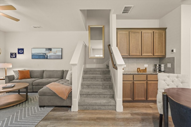 3109 Ethan Ln, Wylie, TX 75098 - staircase featuring wood finished floors and a ceiling fan