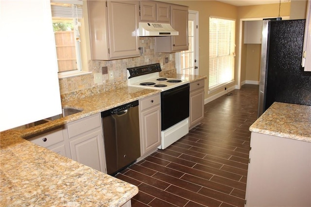 2501 Windchase Dr, Flower Mound, TX 75028 - kitchen featuring appliances with stainless steel finishes, custom range hood, tasteful backsplash, wood finish floors, and light stone countertops