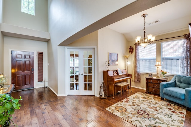 216 Barkley Dr, Hickory Creek, TX 75065 - entryway featuring hardwood / wood-style flooring, a chandelier, lofted ceiling, and french doors