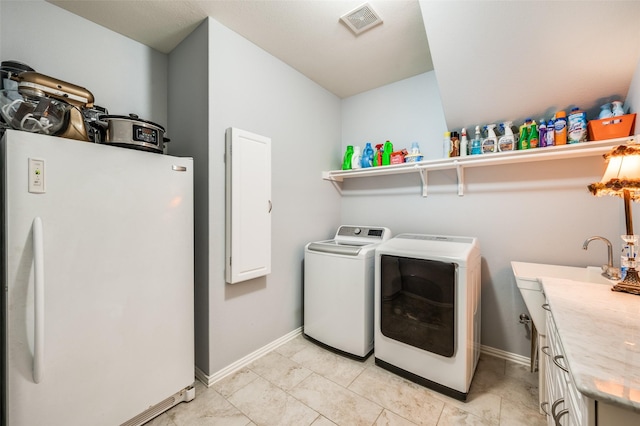 216 Barkley Dr, Hickory Creek, TX 75065 - washroom with independent washer and dryer, cabinet space, and light tile patterned flooring