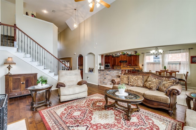 216 Barkley Dr, Hickory Creek, TX 75065 - living area featuring high vaulted ceiling, a ceiling fan, stairway, a chandelier, and arched walkways