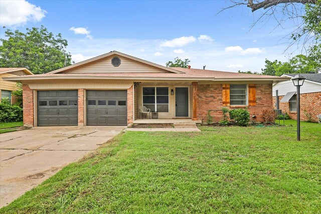 1716 Cordell St, Denton, TX 76201 - view of front of property with an attached garage, a front lawn, brick siding, and driveway