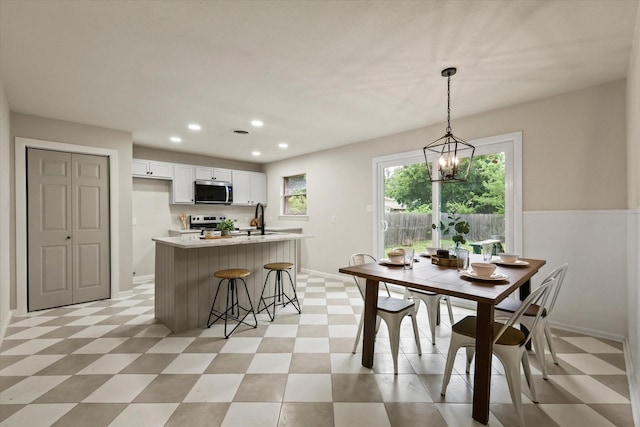 1716 Cordell St, Denton, TX 76201 - dining space with light floors, recessed lighting, and a chandelier