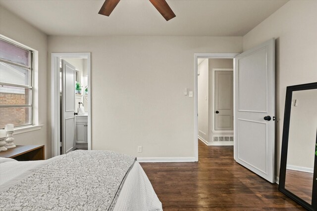 1716 Cordell St, Denton, TX 76201 - bedroom featuring dark wood finished floors, ceiling fan, and connected bathroom