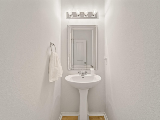 2021 Prospect Ln, Providence Village, TX 76227 - bathroom with baseboards and a sink