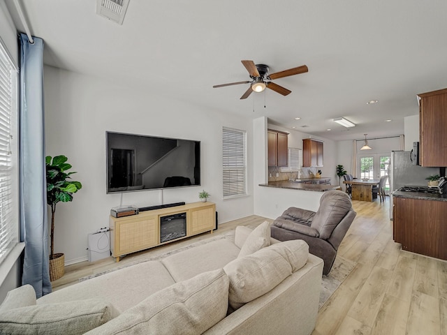 2021 Prospect Ln, Providence Village, TX 76227 - living area featuring ceiling fan, light wood-type flooring, and recessed lighting
