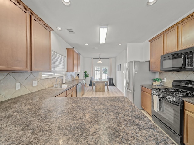 2021 Prospect Ln, Providence Village, TX 76227 - kitchen with black appliances, dark countertops, recessed lighting, and backsplash