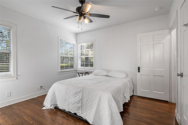 82 Vaughn Dr, Denison, TX 75020 - bedroom featuring wood finished floors, multiple windows, and a ceiling fan