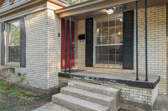 82 Vaughn Dr, Denison, TX 75020 - property entrance featuring brick siding and covered porch