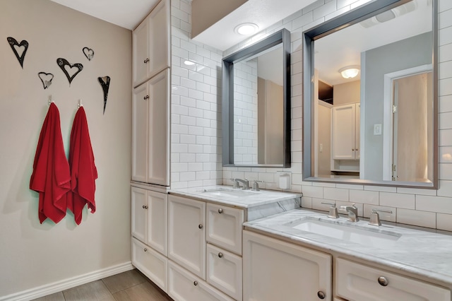 3003 Rustling Leaves Ln, Bedford, TX 76021 - bathroom featuring double vanity and tasteful backsplash