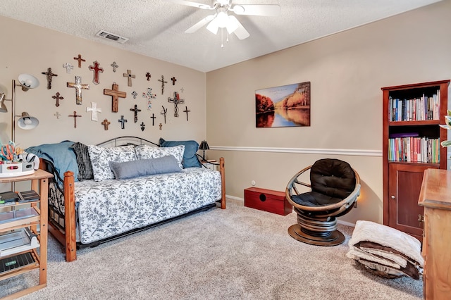 3003 Rustling Leaves Ln, Bedford, TX 76021 - carpeted bedroom featuring a textured ceiling and a ceiling fan