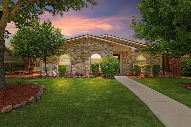 4043 Star Trek Ln, Garland, TX 75044 - ranch-style home with brick siding and a yard