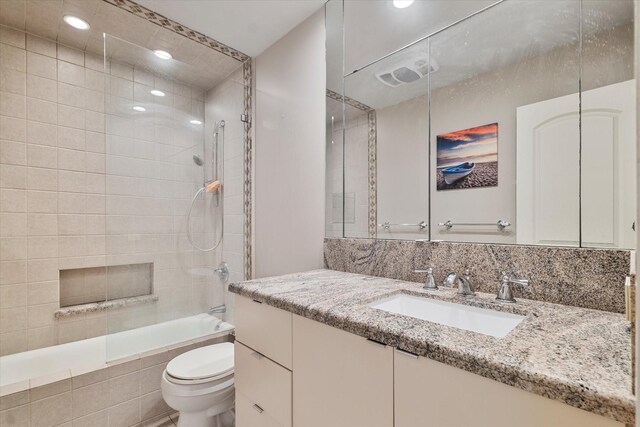 4043 Star Trek Ln, Garland, TX 75044 - bathroom with vanity, tiled shower / bath, and recessed lighting