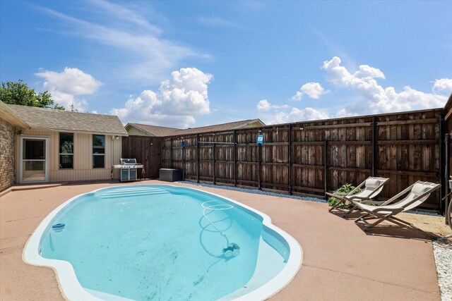 4043 Star Trek Ln, Garland, TX 75044 - view of swimming pool with area for grilling and a patio area