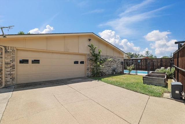 4043 Star Trek Ln, Garland, TX 75044 - view of home's exterior featuring brick siding and driveway