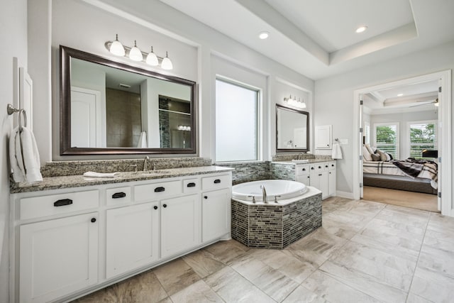 6603 Erin Ln, Parker, TX 75002 - ensuite bathroom featuring two vanities, a tray ceiling, tiled shower, a garden tub, and recessed lighting