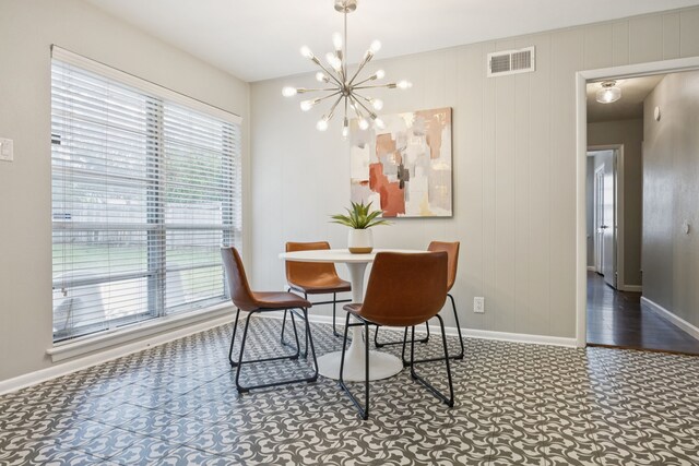 11335 Fernald Ave, Dallas, TX 75218 - dining room with a chandelier and baseboards