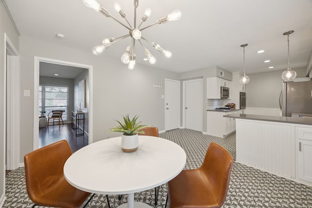11335 Fernald Ave, Dallas, TX 75218 - dining room featuring a chandelier and recessed lighting