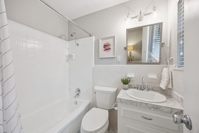 11335 Fernald Ave, Dallas, TX 75218 - bathroom with shower / bath combo, vanity, and tile walls