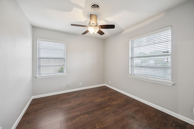 11335 Fernald Ave, Dallas, TX 75218 - empty room with plenty of natural light, ceiling fan, and dark wood-type flooring