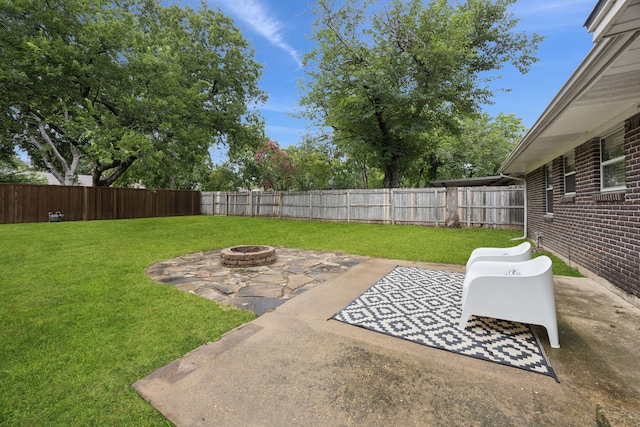 11335 Fernald Ave, Dallas, TX 75218 - fenced backyard with a fire pit and a patio