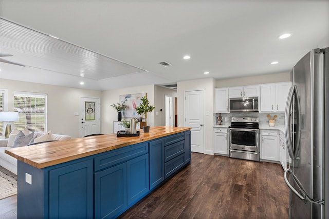 102 Collin Ct, Prosper, TX 75078 - kitchen with stainless steel appliances, wooden counters, white cabinets, and recessed lighting