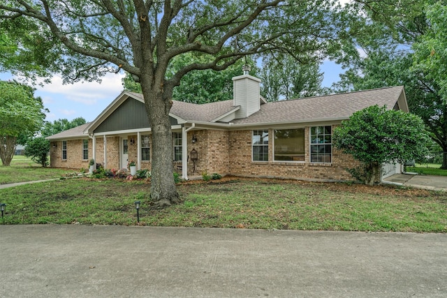 102 Collin Ct, Prosper, TX 75078 - single story home featuring brick siding, a chimney, roof with shingles, and a front lawn