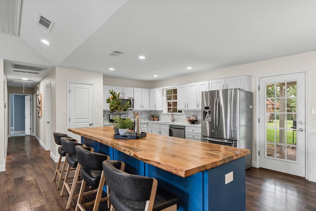 102 Collin Ct, Prosper, TX 75078 - kitchen featuring butcher block counters, appliances with stainless steel finishes, dark wood finished floors, and recessed lighting
