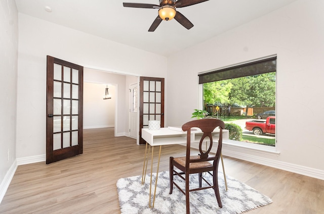 4410 Briargrove Ln, Dallas, TX 75287 - dining area featuring french doors, light wood-style flooring, a ceiling fan, and a desk