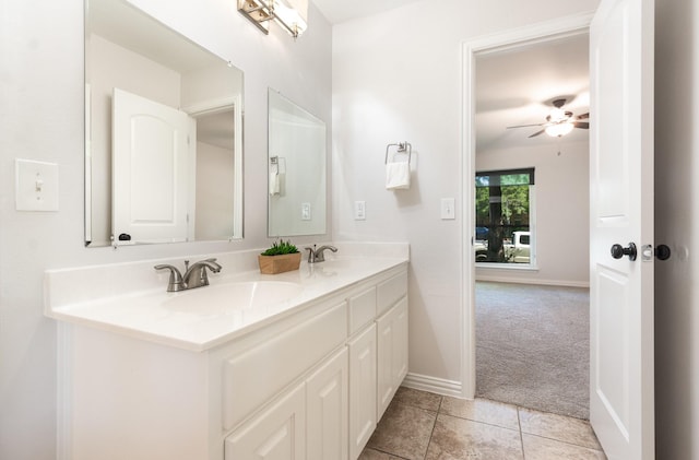 4410 Briargrove Ln, Dallas, TX 75287 - full bathroom with double vanity, a ceiling fan, and tile patterned flooring