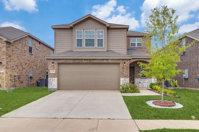 2058 Henrietta Dr, Forney, TX 75126 - traditional-style home featuring driveway, a front yard, a garage, and brick siding