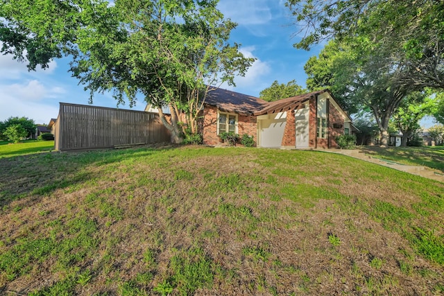 1024 E Peters Colony Rd, Carrollton, TX 75007 - view of front facade featuring a front yard and brick siding