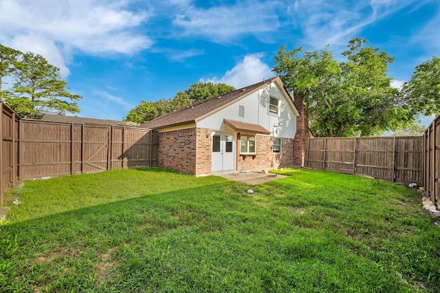 1024 E Peters Colony Rd, Carrollton, TX 75007 - back of property with brick siding and a fenced backyard
