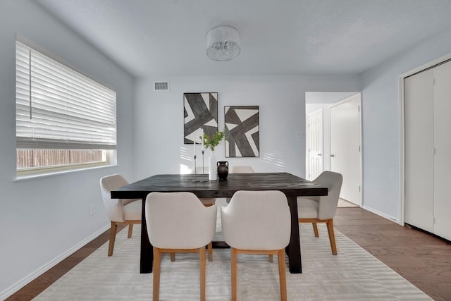 1024 E Peters Colony Rd, Carrollton, TX 75007 - dining room featuring wood finished floors and baseboards