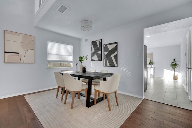1024 E Peters Colony Rd, Carrollton, TX 75007 - dining space with wood finished floors and baseboards