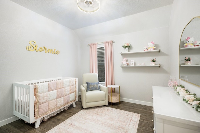 8116 Charford Dr, Fort Worth, TX 76131 - bedroom featuring a crib, wood finished floors, and vaulted ceiling