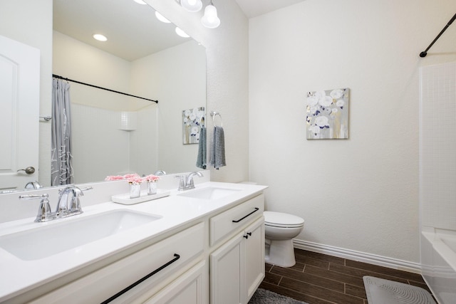 8116 Charford Dr, Fort Worth, TX 76131 - full bath featuring double vanity, wood tiled floors, and shower / tub combo