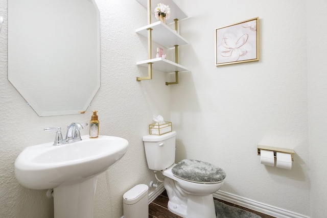 8116 Charford Dr, Fort Worth, TX 76131 - half bathroom with a sink and wood finished floors
