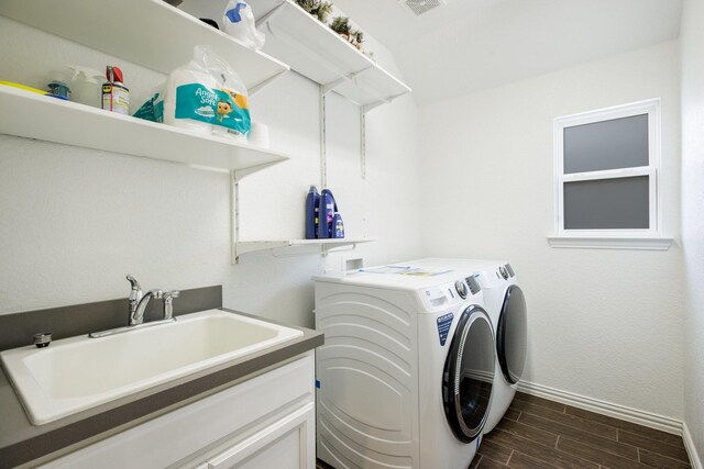 8116 Charford Dr, Fort Worth, TX 76131 - laundry room featuring washer and dryer and wood tiled floors