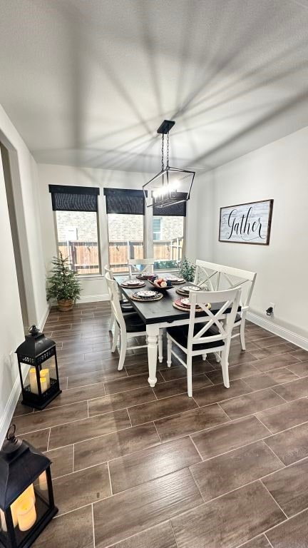 1518 Primrose Pl, Haslet, TX 76052 - dining area with wood tiled floors and a chandelier