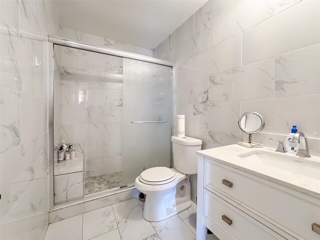 503 White Oak St, Allen, TX 75002 - full bath with marble look tiles, a marble finish shower, vanity, and tile walls