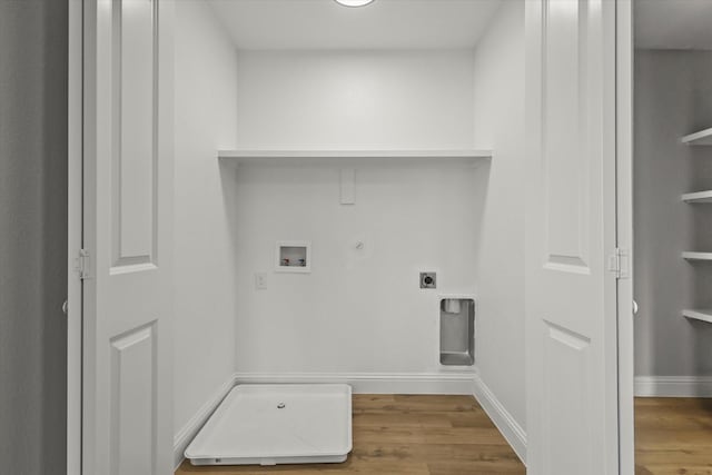 6311 Pebble Ave, Dallas, TX 75217 - laundry area with hookup for a gas dryer, hookup for an electric dryer, wood finished floors, and hookup for a washing machine