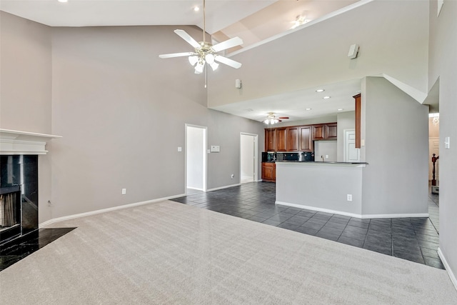 3212 Cantura Dr, Mesquite, TX 75181 - unfurnished living room featuring a ceiling fan, high vaulted ceiling, dark tile patterned flooring, a premium fireplace, and recessed lighting
