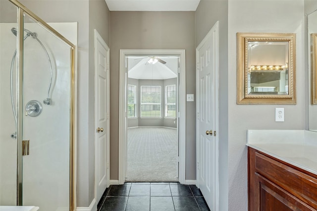 3212 Cantura Dr, Mesquite, TX 75181 - bathroom featuring ceiling fan, vanity, a shower stall, and tile patterned flooring