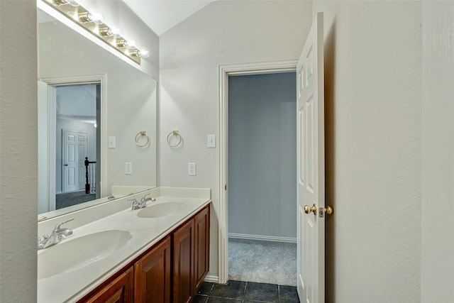 3212 Cantura Dr, Mesquite, TX 75181 - full bath with vaulted ceiling, double vanity, and tile patterned flooring