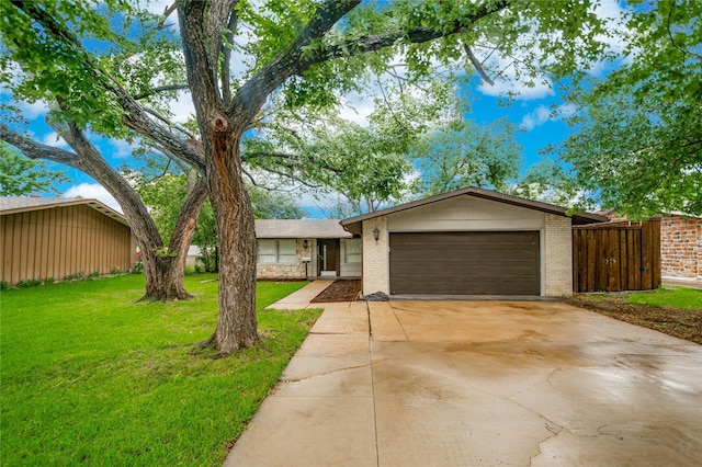 2305 Briarwood Ln, Carrollton, TX 75006 - view of front of home featuring brick siding, a garage, and concrete driveway