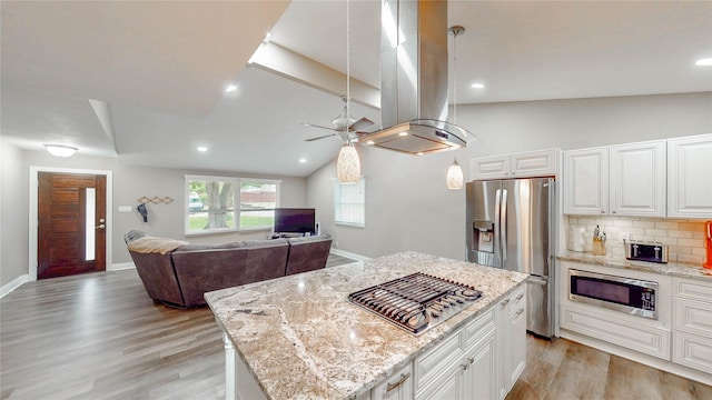 2305 Briarwood Ln, Carrollton, TX 75006 - kitchen featuring stainless steel appliances, island range hood, a ceiling fan, light wood-style floors, and light stone countertops