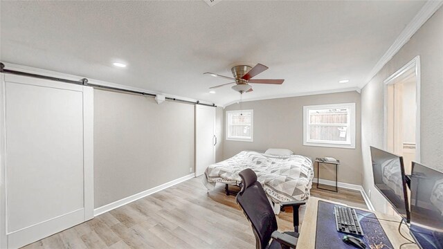 2305 Briarwood Ln, Carrollton, TX 75006 - bedroom with a barn door, ornamental molding, wood finished floors, recessed lighting, and a ceiling fan