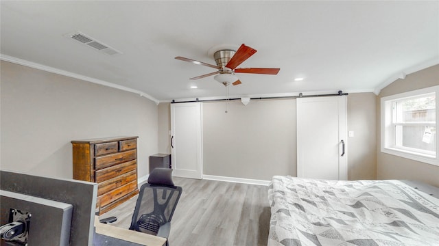 2305 Briarwood Ln, Carrollton, TX 75006 - bedroom with a barn door, light wood-style flooring, crown molding, recessed lighting, and ceiling fan