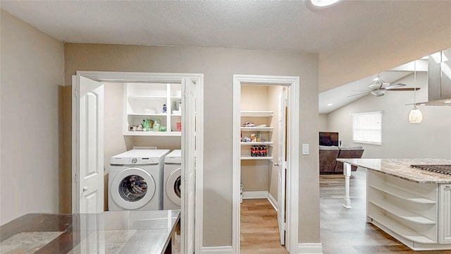 2305 Briarwood Ln, Carrollton, TX 75006 - laundry room featuring ceiling fan, light wood finished floors, washing machine and clothes dryer, and a textured ceiling